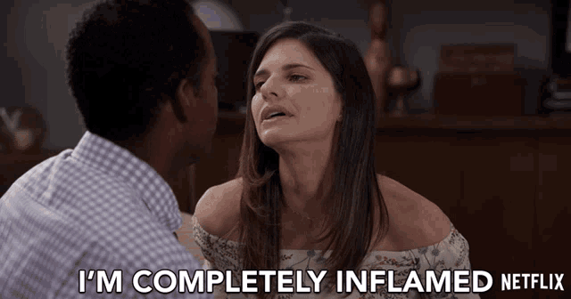 a man and a woman are looking at each other and the woman says " i 'm completely inflamed netflix "