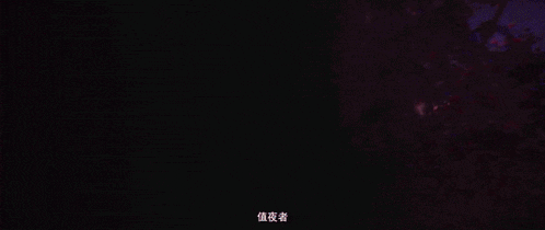 a red light is coming out of a dark room