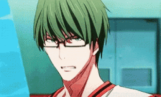 a man with green hair and glasses is wearing a red and white shirt .