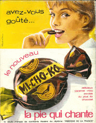 a woman is eating a micho-ko candy on a yellow background