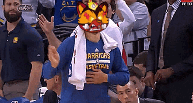 a man wearing a golden state warriors basketball jersey