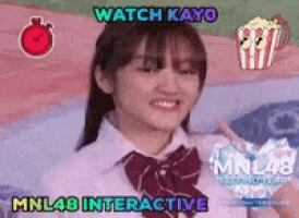 a girl in a school uniform is giving a thumbs up and says watch kayo mnl48 interactive