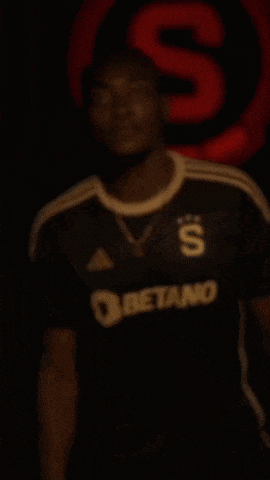 a man wearing a black adidas jersey with betan on the front