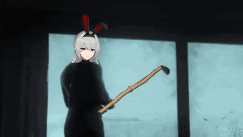 a girl in bunny ears is holding a stick