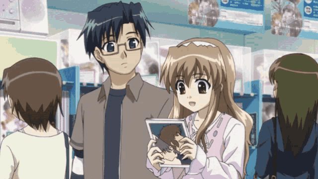 a man and a girl are looking at a picture together in a store