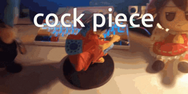 a statue of a man sitting on a table with the words cock piece written above him