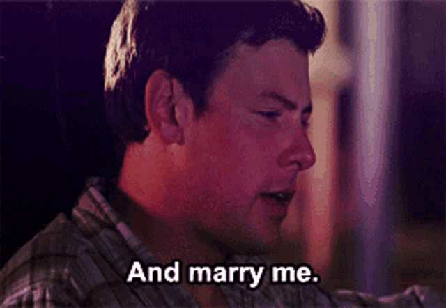 a man is saying " and marry me " in a purple background