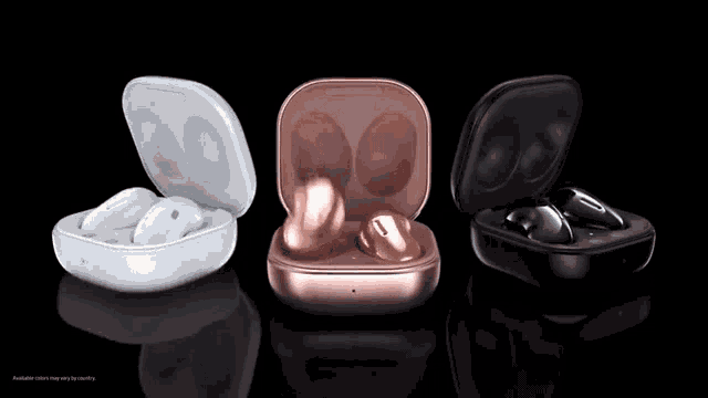 three different colored samsung earbuds are displayed on a black surface