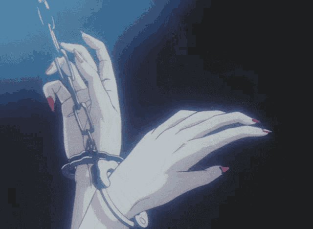 a woman 's hand is chained to a chain