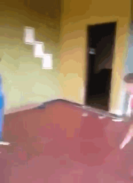 a blurred image of a room with a red carpet