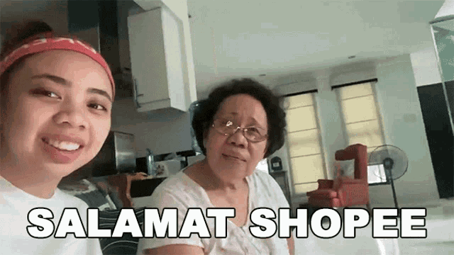 two women posing for a picture with the words salamat shopee written on the bottom