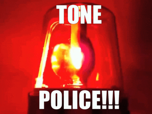 a red light with the words " tone police " on it