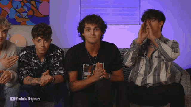 a group of young men sitting on a couch with youtube originals written on the bottom right