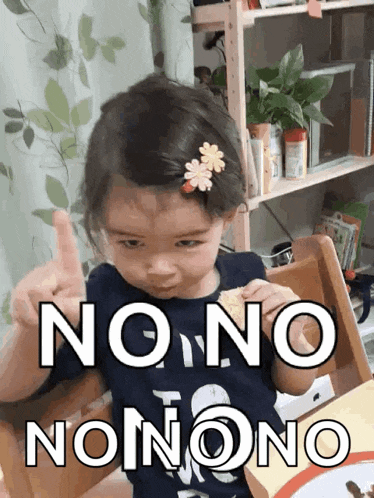 a little girl with a flower in her hair is giving a thumbs up with the words " no no nonono " above her
