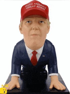 a statue of trump wearing a make america great again hat