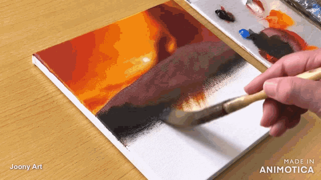 a painting is being painted on a canvas with the words made in animatica at the bottom