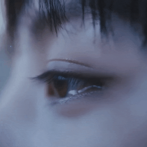 a close up of a person 's eye with mascara on