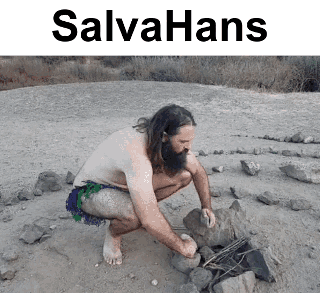 a man squatting in the dirt with the word salvahans on the top