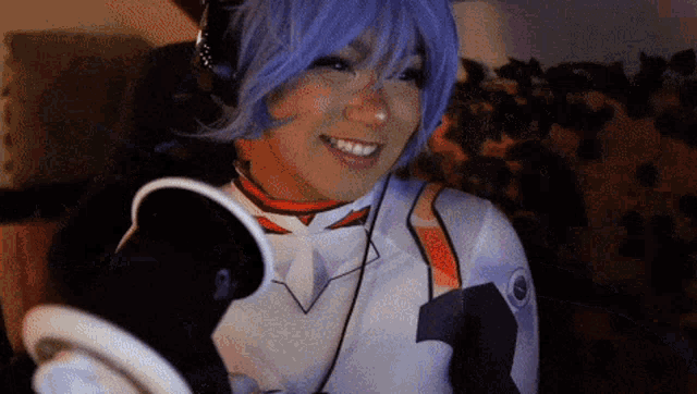 a woman in a purple wig and headphones is smiling