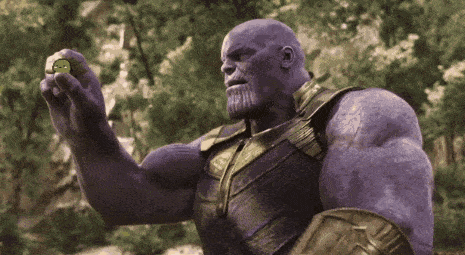 thanos from avengers infinity war is holding a pickle