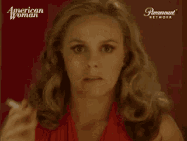 a woman smoking a cigarette in front of a paramount network logo