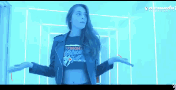 a woman wearing a shirt that says toronto is dancing