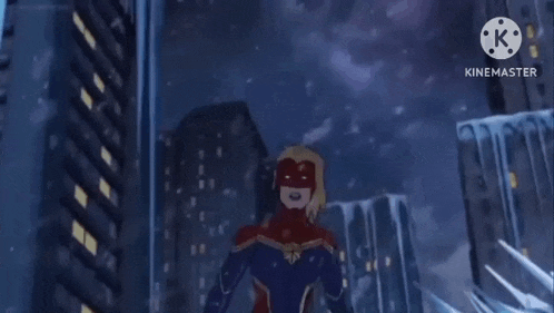 captain marvel is standing in front of a building in a city at night .