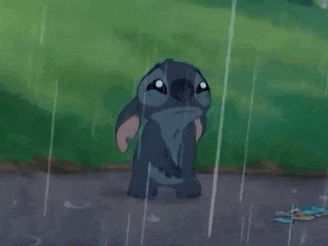 a cartoon character is laying in the rain .