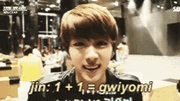 a close up of a person 's face with the words jin : 1 + 1 = gwiyomi written on the bottom