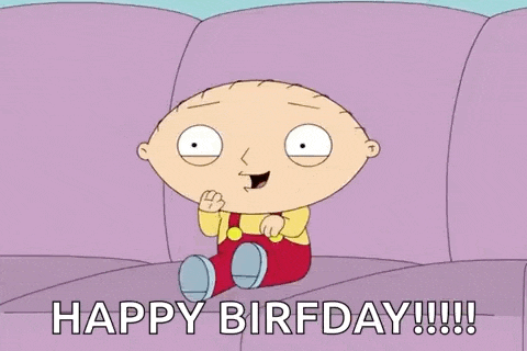 a cartoon character from family guy is sitting on a couch and saying happy birthday .