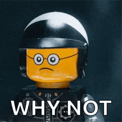 a lego man wearing a helmet and glasses is holding a cigarette and says `` why not '' .