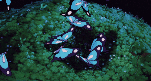a group of butterflies are flying in a circle in the grass