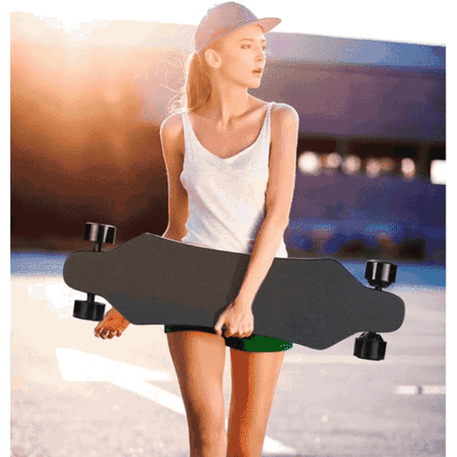 a woman carrying a black skateboard with a hat on