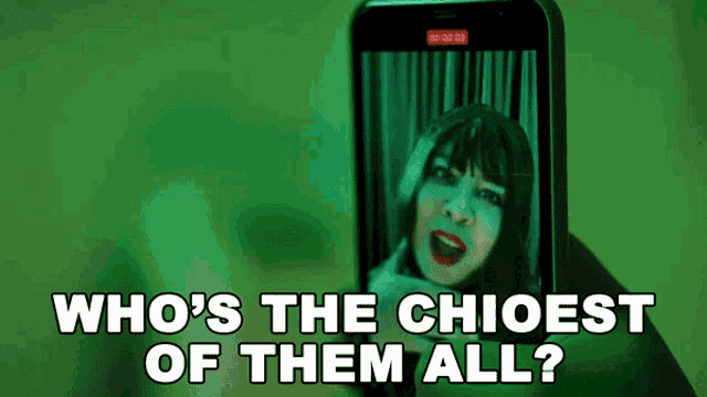 someone is holding a cell phone with a picture of a woman on it and the words who 's the chioest of them all