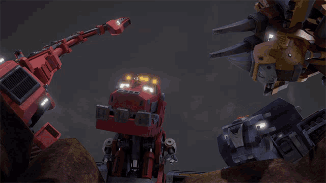 a red robot with a yellow and blue robot standing next to it