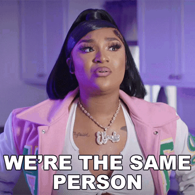 a woman wearing a pink jacket and a white tank top says we 're the same person