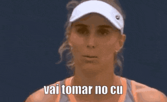 a close up of a woman wearing a visor with the words filha da puta below her