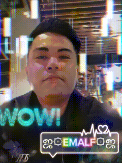 a man is standing in front of a screen that says wow on it