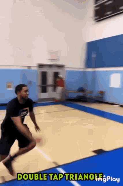 a double tap triangle is being performed on a court