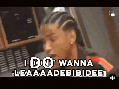 a close up of a person 's face with the words `` i do wanna leaaadebibidee '' written on it .