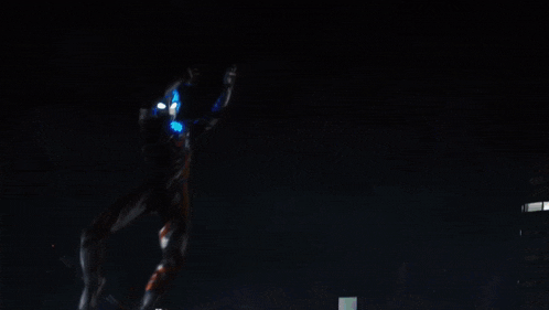 a monster is standing on top of a building with a sign that says ' a ' on it