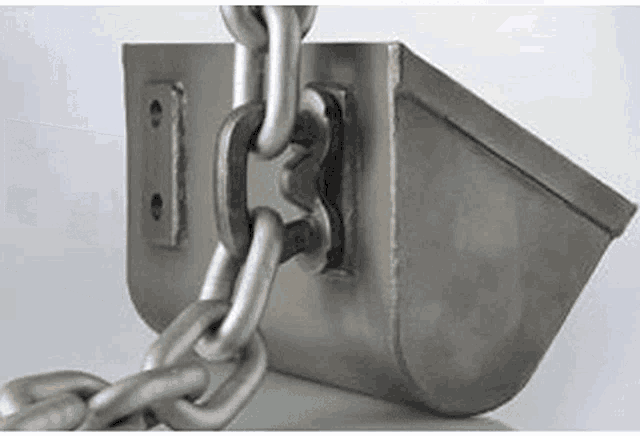 a close up of a metal object with chains attached to it .