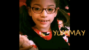 a young girl wearing glasses is smiling with the words yummy written in yellow