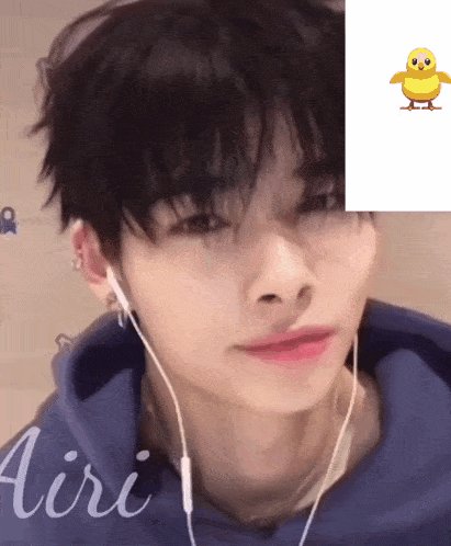 a close up of a person wearing headphones with a picture of a yellow duck behind them