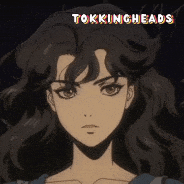 a close up of a woman 's face with the words tokingheads written above her