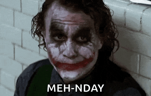 a close up of the joker 's face with a smiley face and the words meh-nday behind him .