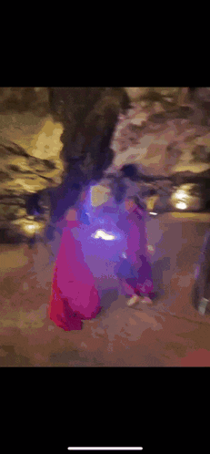 a blurry picture of a person standing in a dark room