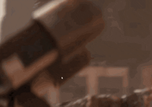 a close up of a brown object on a table with a blurred background