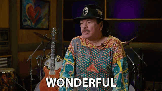 a man in a colorful shirt and hat says wonderful