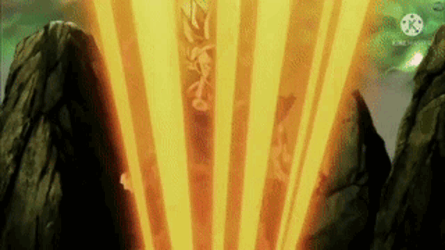 a person is standing in the middle of a mountain with a beam of light coming out of the mountains .